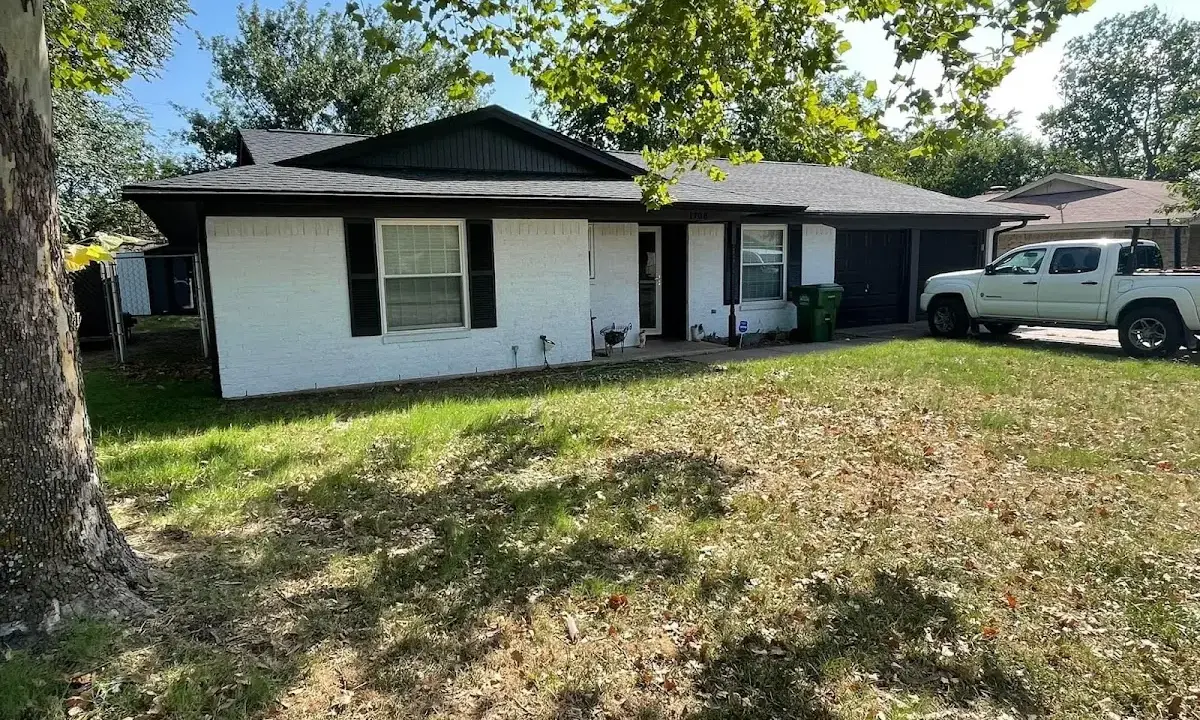 Professional roofing crew working on a residential roof in Mendota